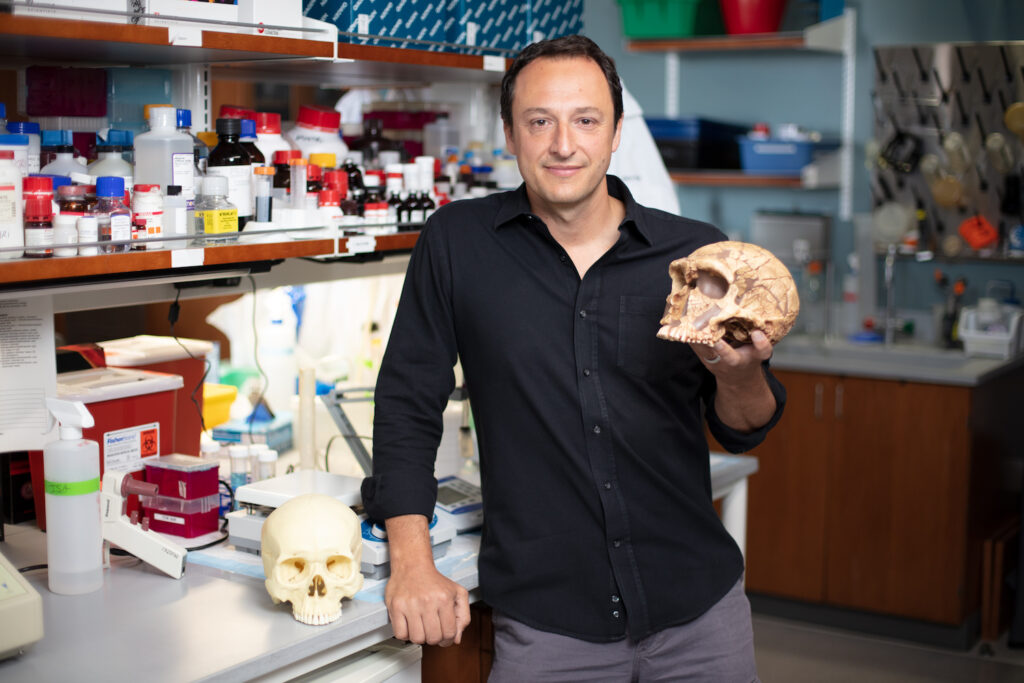 Alysson Muotri UCSD Professor in his lab holding a human skull